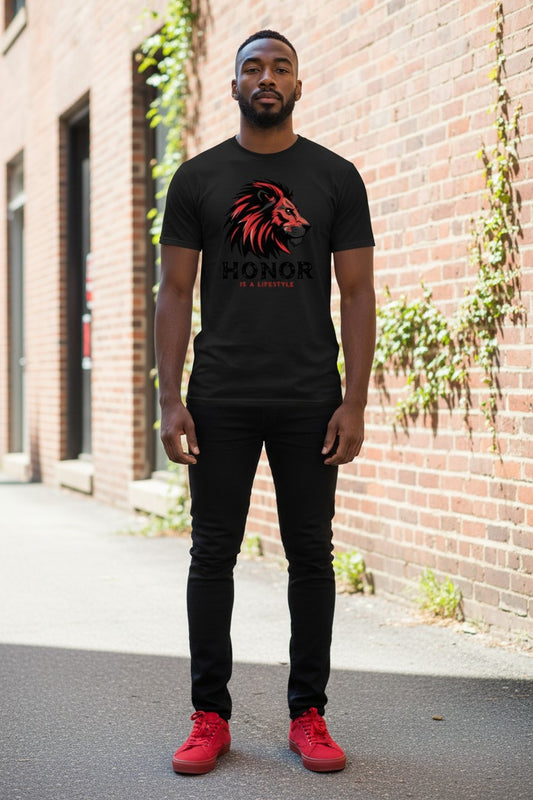 Man wearing a black t-shirt with a lion graphic and 'Honor' text, standing in front of a brick wall.