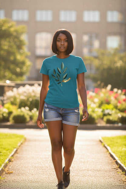 Woman wearing a blue t-shirt with a leaf design in an outdoor setting