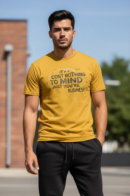 Man wearing a yellow t-shirt with text outdoors