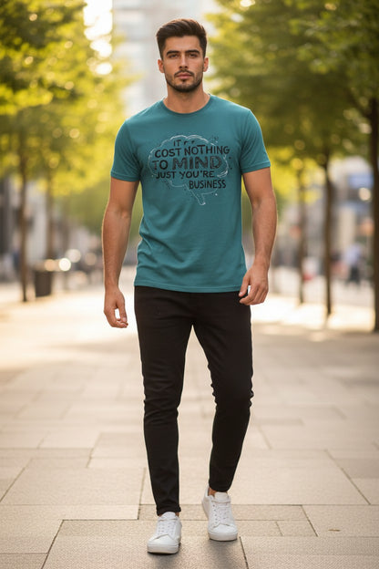 Man wearing a teal t-shirt with text on a city street