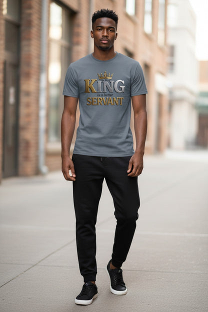Man wearing a gray t-shirt with 'King Servant' text in an urban setting