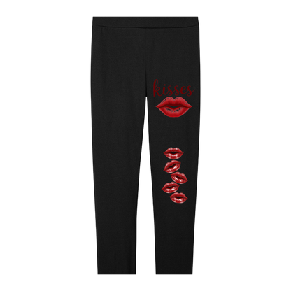 Black leggings with red lip prints and 'kisses' text on a white background