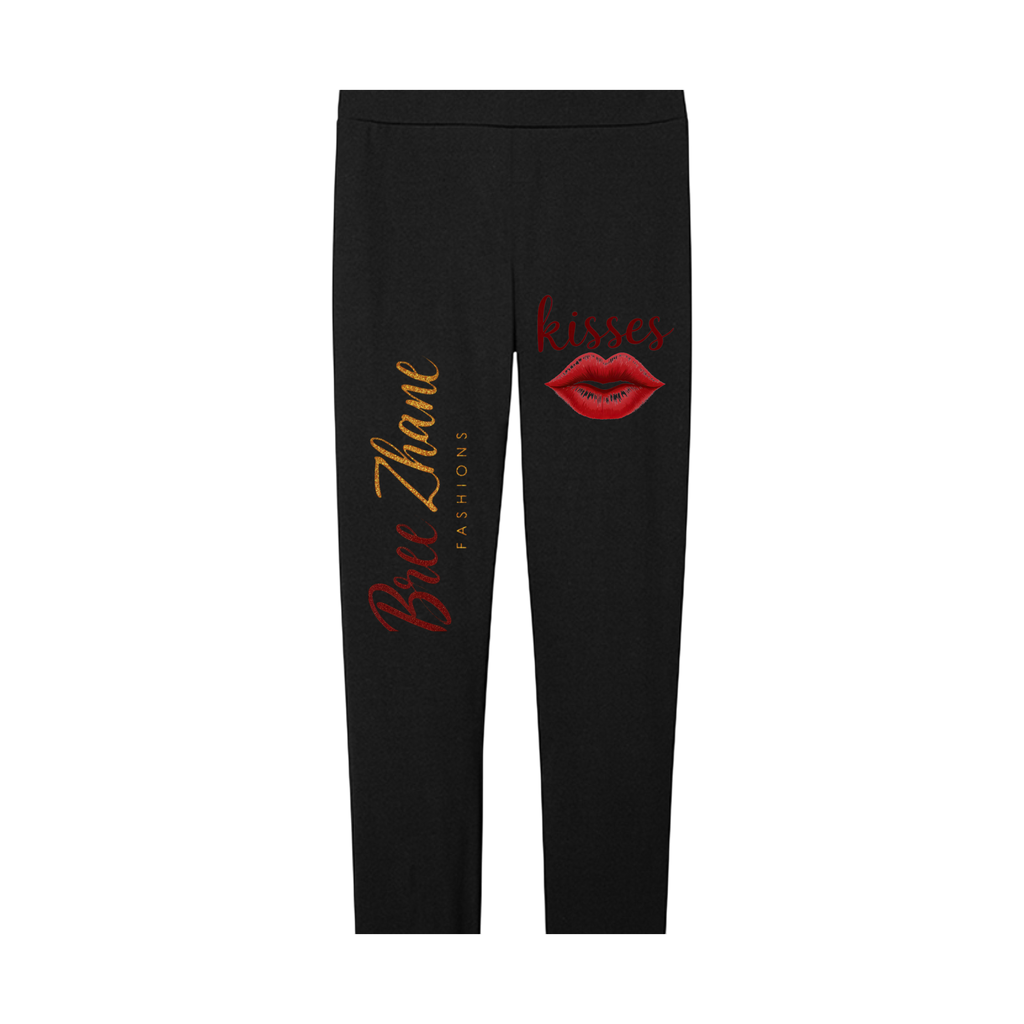 Black leggings with red lip print and text on a white background
