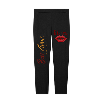 Black leggings with red lip print and text on a white background
