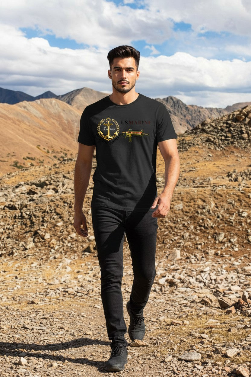 Man wearing a black t-shirt with a graphic design in a desert landscape