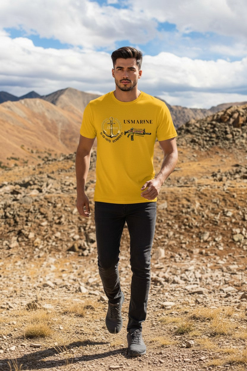 Man wearing a yellow t-shirt with a graphic design in a desert landscape