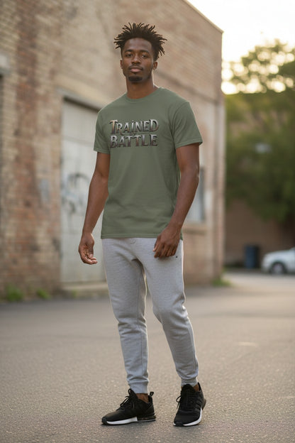 Man wearing a green t-shirt with text, standing on a street with a brick building in the background.