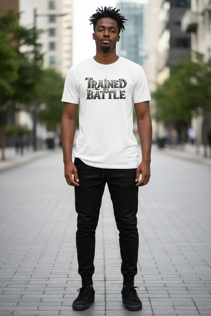Person wearing a white t-shirt with 'Trained in Battle' text on a city street.