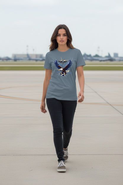 Woman wearing a t-shirt with an eagle design on an airport runway.