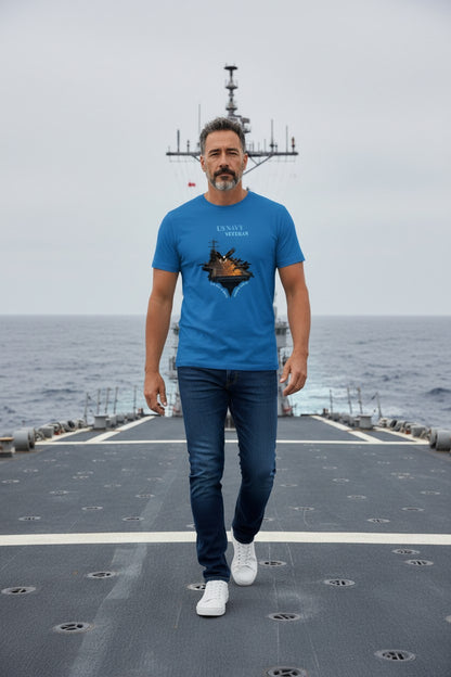 Man wearing a blue t-shirt with a graphic design on a ship deck.