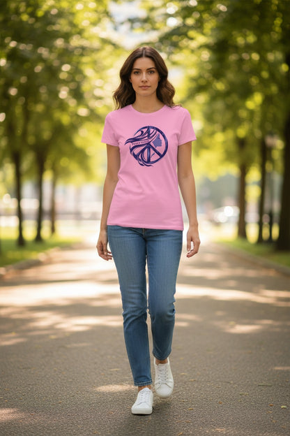 Woman wearing a pink t-shirt with a logo, walking on a path in a park.