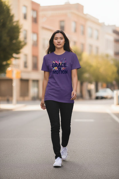 Woman wearing a purple t-shirt with text walking on a street.