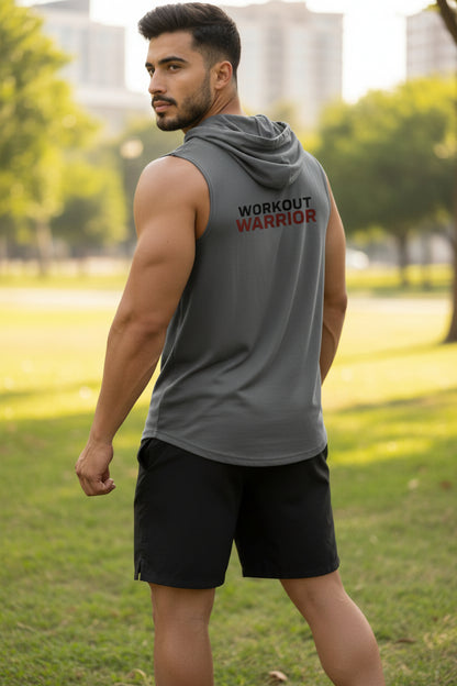 Man wearing a sleeveless hoodie with 'Workout Warrior' text in a park.